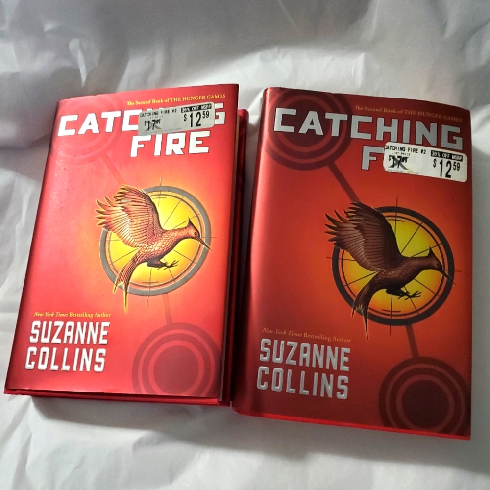 : 2 catching fire hunger games books by Suzanne Collins hard cover book club